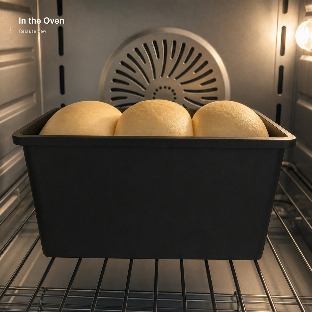 SANNENG SN2196 cast aluminum loaf pan shown baking a loaf in the oven